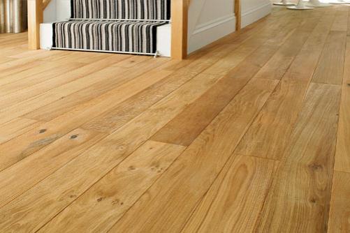 A front room in a home with new, quality solid oak flooring installed.