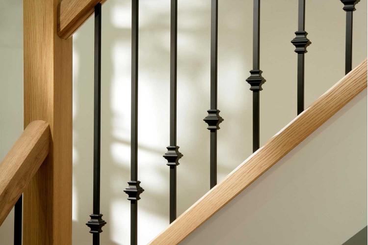 Black metal stair spindles in a room