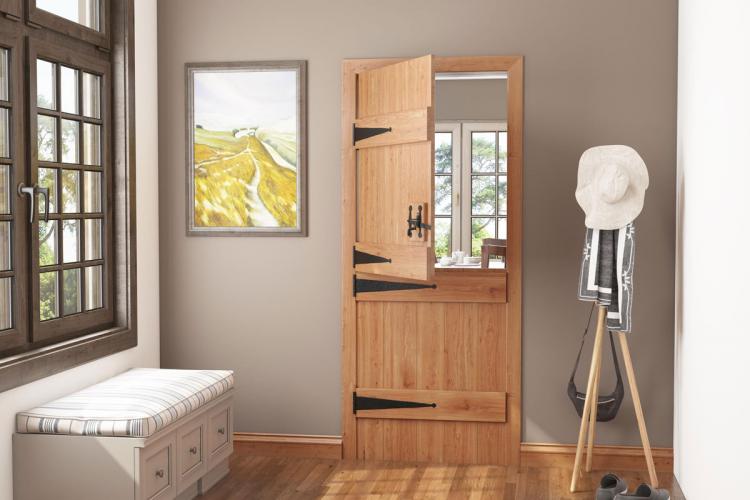 The inside of a cottage home with a Solid Oak Ledged Stable Door half-open.