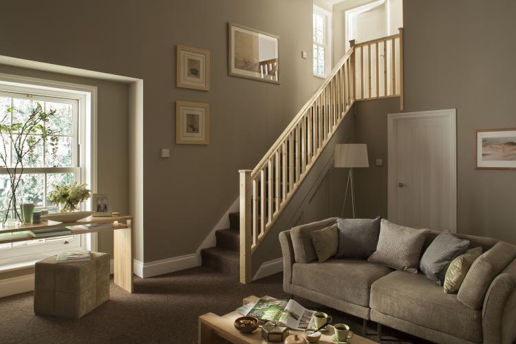 A picture of the Plain Square range of stair parts we stock here at Blueprint Joinery in someones living room.