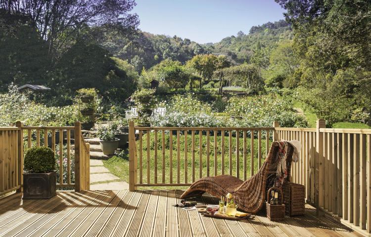 A picture of a garden on a sunny day with Square Decking Balustrade