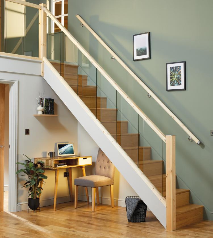 Glass stair panels with pine handrail, base rail and newel posts.
