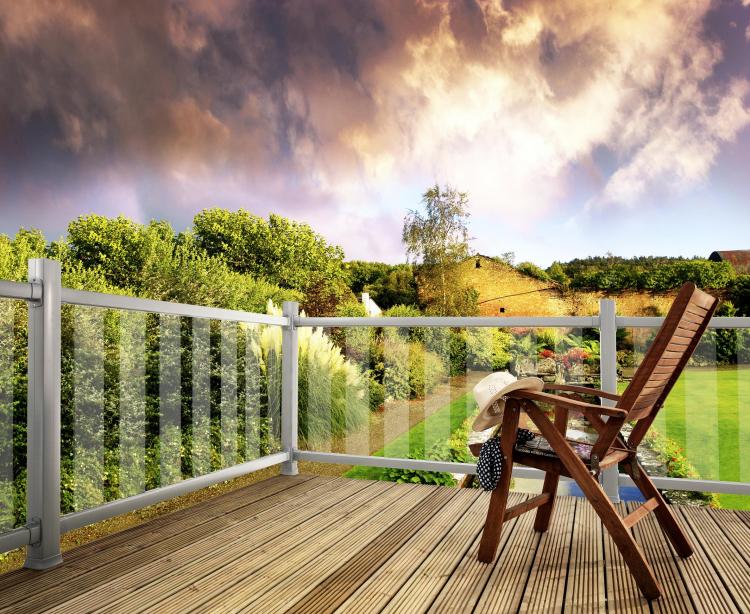 A picture of a garden on a sunny day with Modern Metal and Glass Decking Balustrade